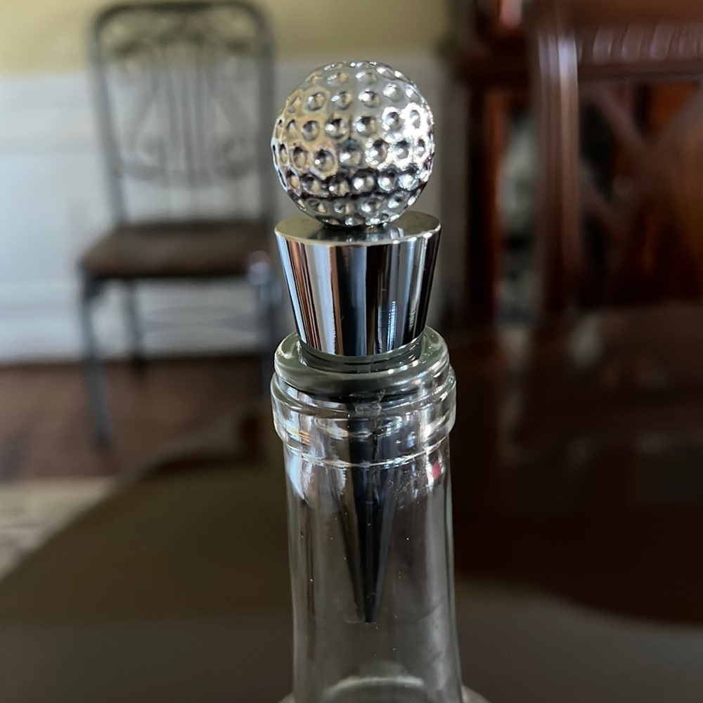 Golf ball bottle stopper.